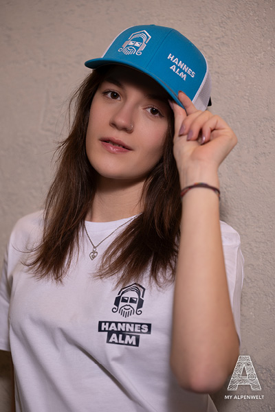 blue-white Hannes Alm cap with Alpenwelt, Susi Alm, Hannes Alm, and Zillertal Arena logos